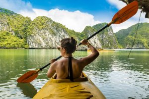 kayaking among Karst islands of Halong Bay