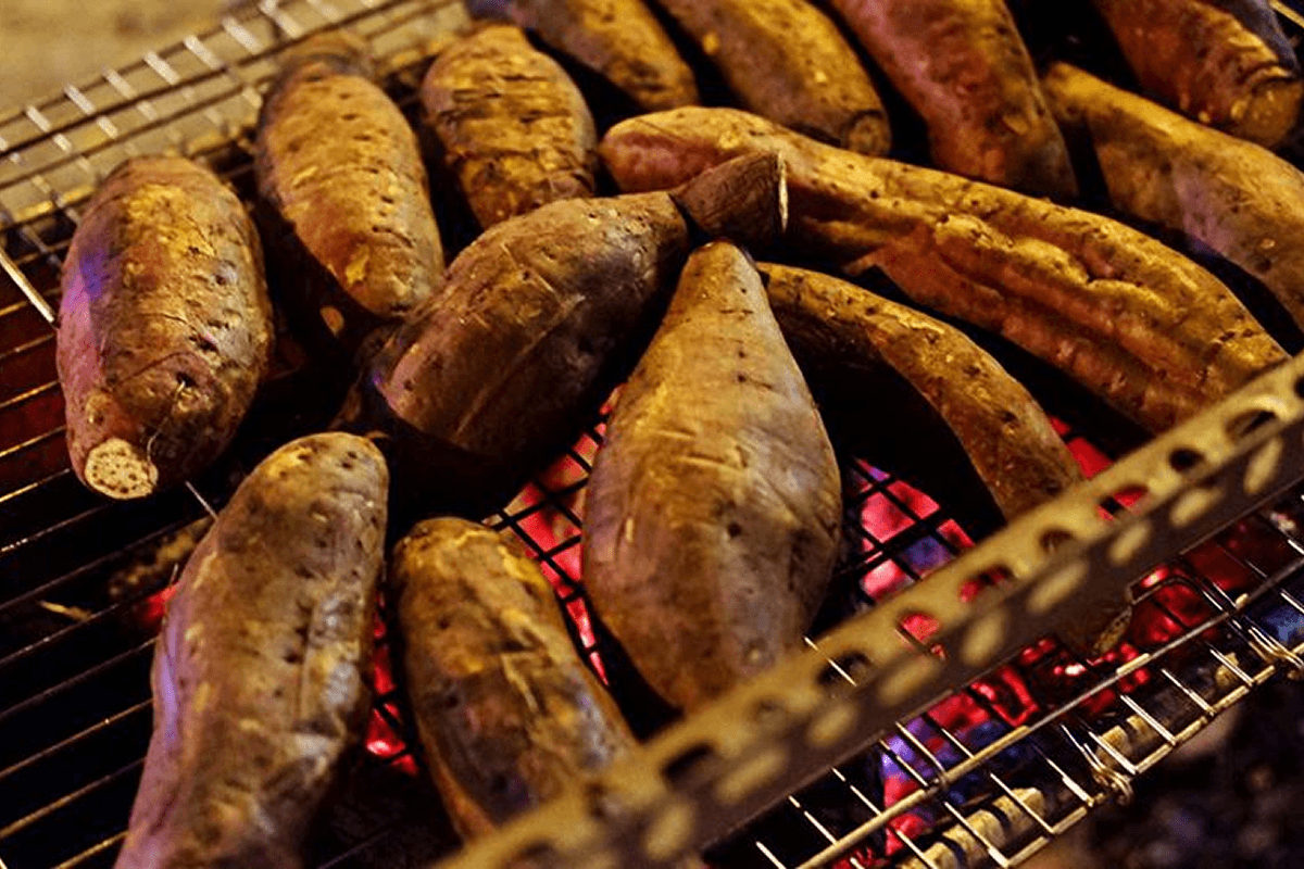 charcoal roasted sweet potatoes street vendor Vietnam