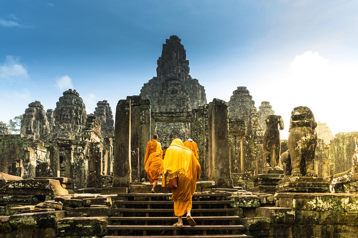 Monks walking toward the temple entrance