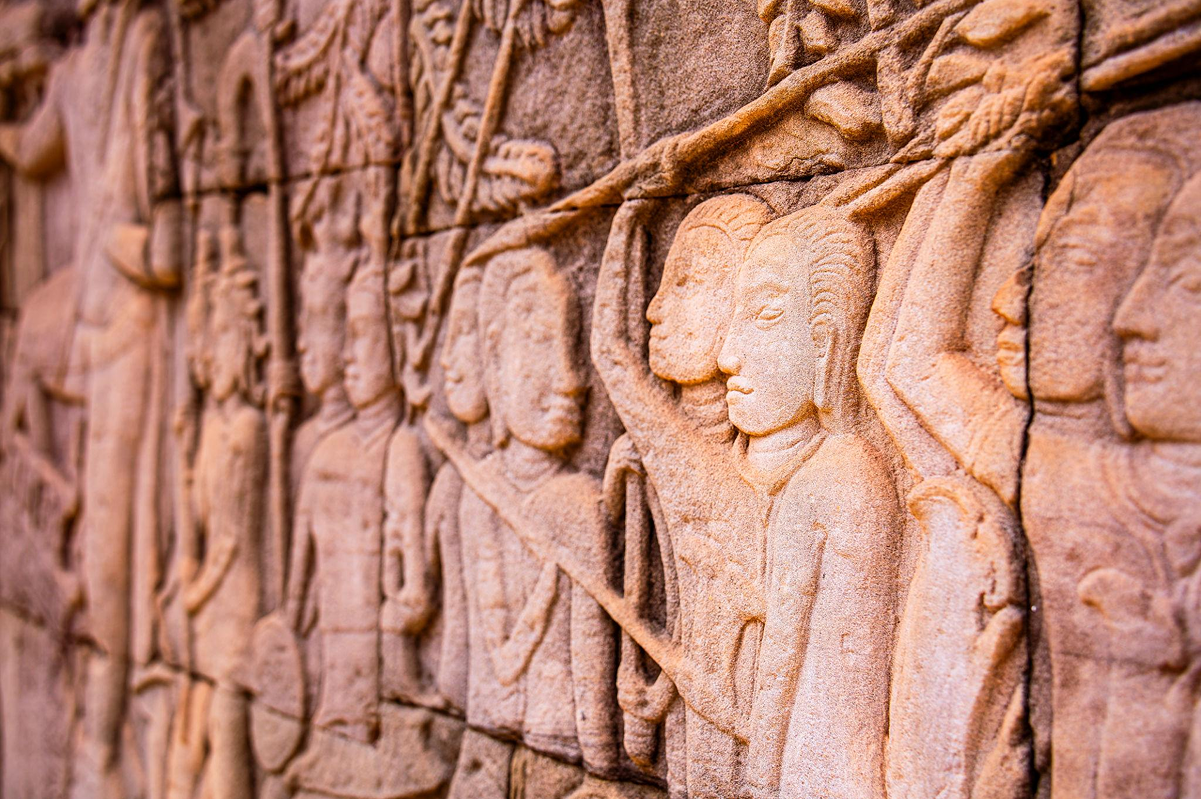 Detailed bas-reliefs carved into temple walls
