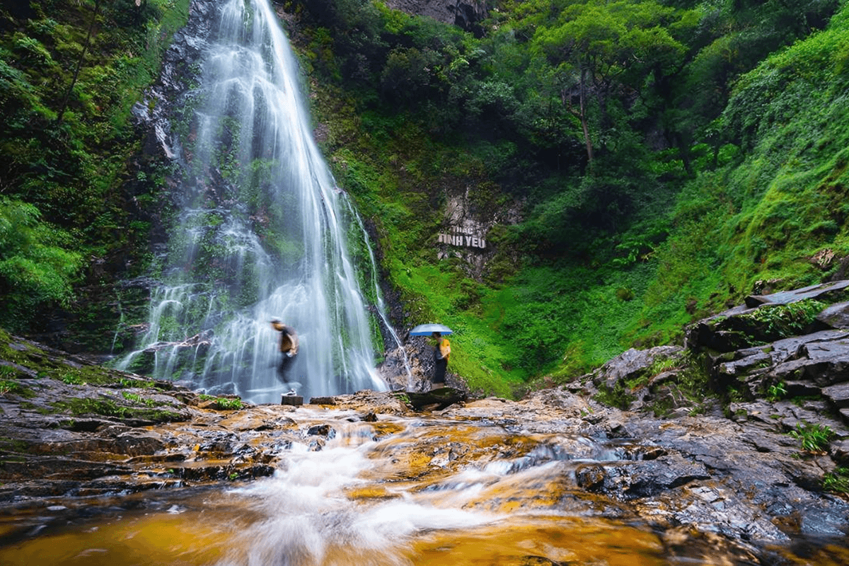 Love Waterfall surrounded by forest and nature near SapaCaption