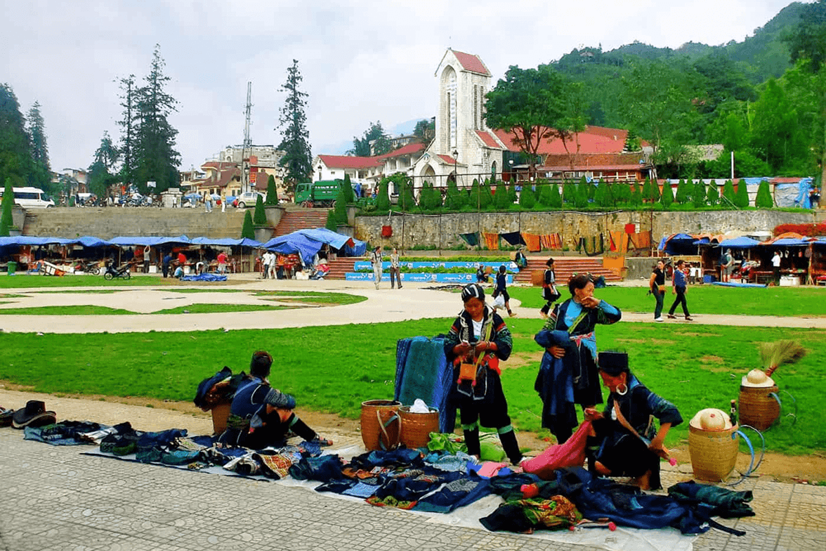 sapa love market area with local stalls and Sapa Stone Church in the background