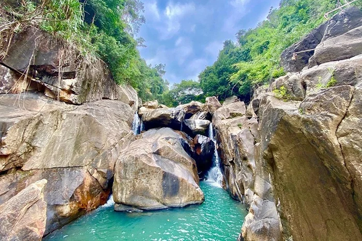 Three-tier waterfall system forming natural pools at Ba Ho