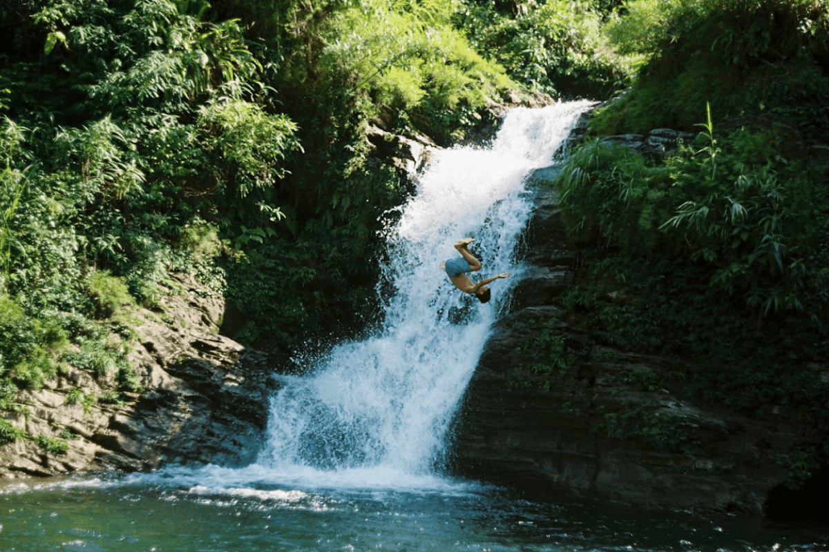 Jumping Into Du Gia Waterfall